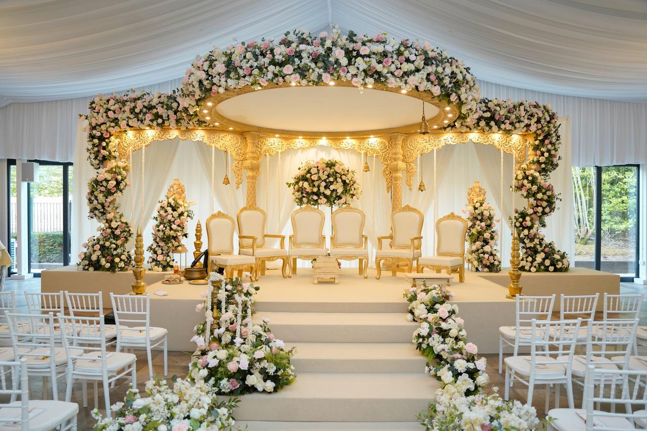 Luxurious Royal Indian Wedding stage with floral arch